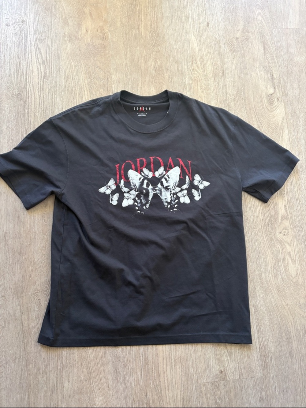 Jordan Black Short Sleeve Tee with Red Logo and White Butterfly Graphic